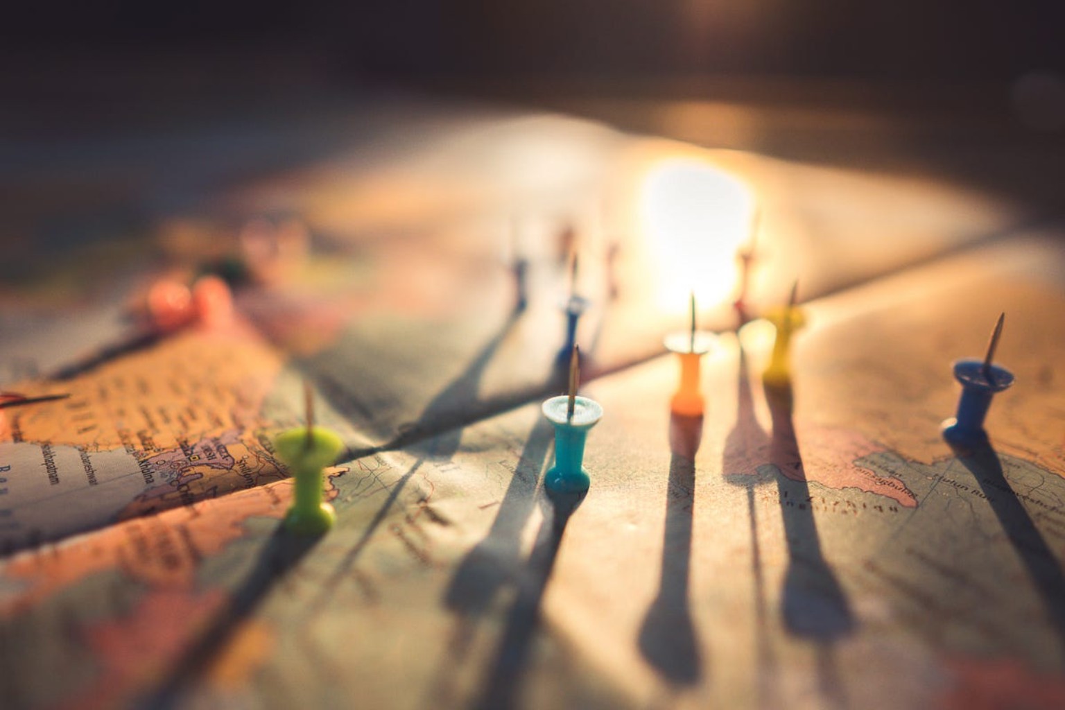 Pins and routes on a map representing ideas and direction